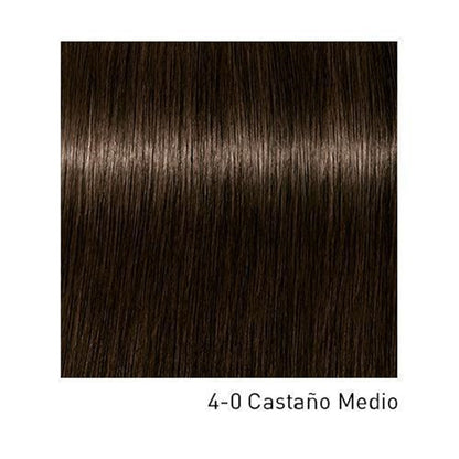 Tinte Schwarzkopf Igora Royal de color intenso y duradero en un frasco con tapa blanca y etiqueta colorida.