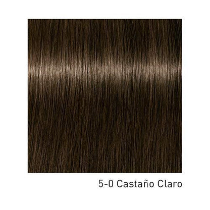 Tinte Schwarzkopf Igora Royal en botella, muestra el color de cabello rubio oscuro con tono vibrante y acabado brillante.