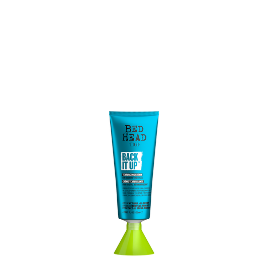 Botella cilíndrica con dosificador de 125ml de Crema Texturizante Back It Up Bed Head by TIGI, crema de peinado y definición flexible con memoria de forma.