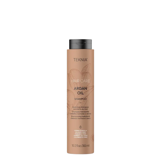 Champú Lakme Teknia con aceite de argán en botella de 300 ml, muestra la etiqueta y el envase del producto para el cabello.