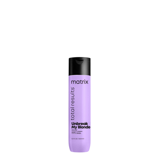 Champú reparador Matrix Unbreak My Blonde para cabello rubio dañado y debilitado, visible en la botella con etiquetado amarillo y morado